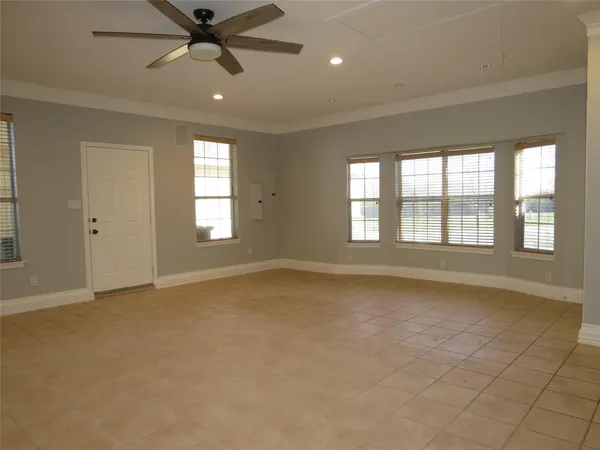 a view of an empty room with a window
