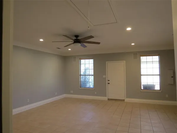 a view of an empty room with a window