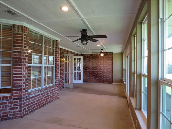 a view of an empty room with a windows