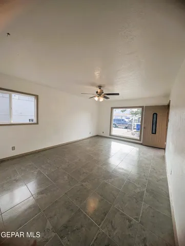 a view of an empty room with a window