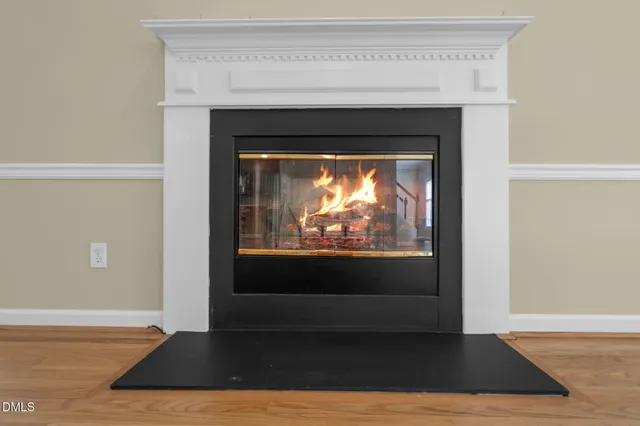 a view of fireplace with wooden floor