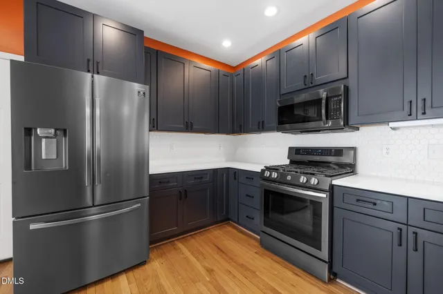 a view of a hallway with stairs