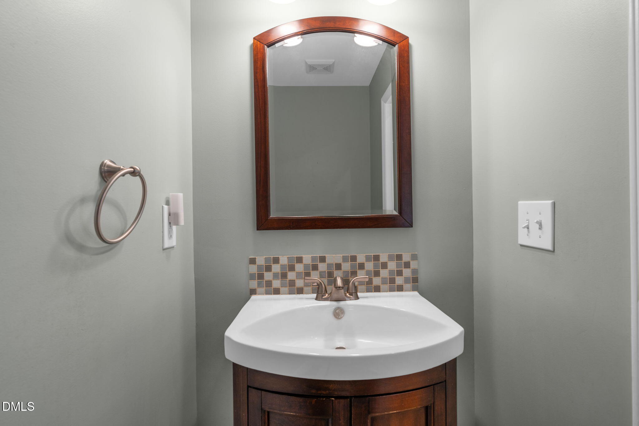 16 Quail Hunt Circle Durham, NC 27712 - Photo 20 of 61 a bathroom with a sink and a mirror