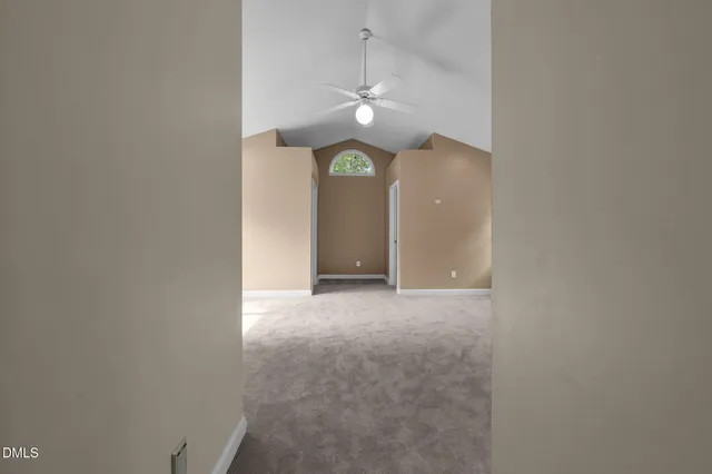 a bathroom with a double vanity sink a toilet a window and mirror