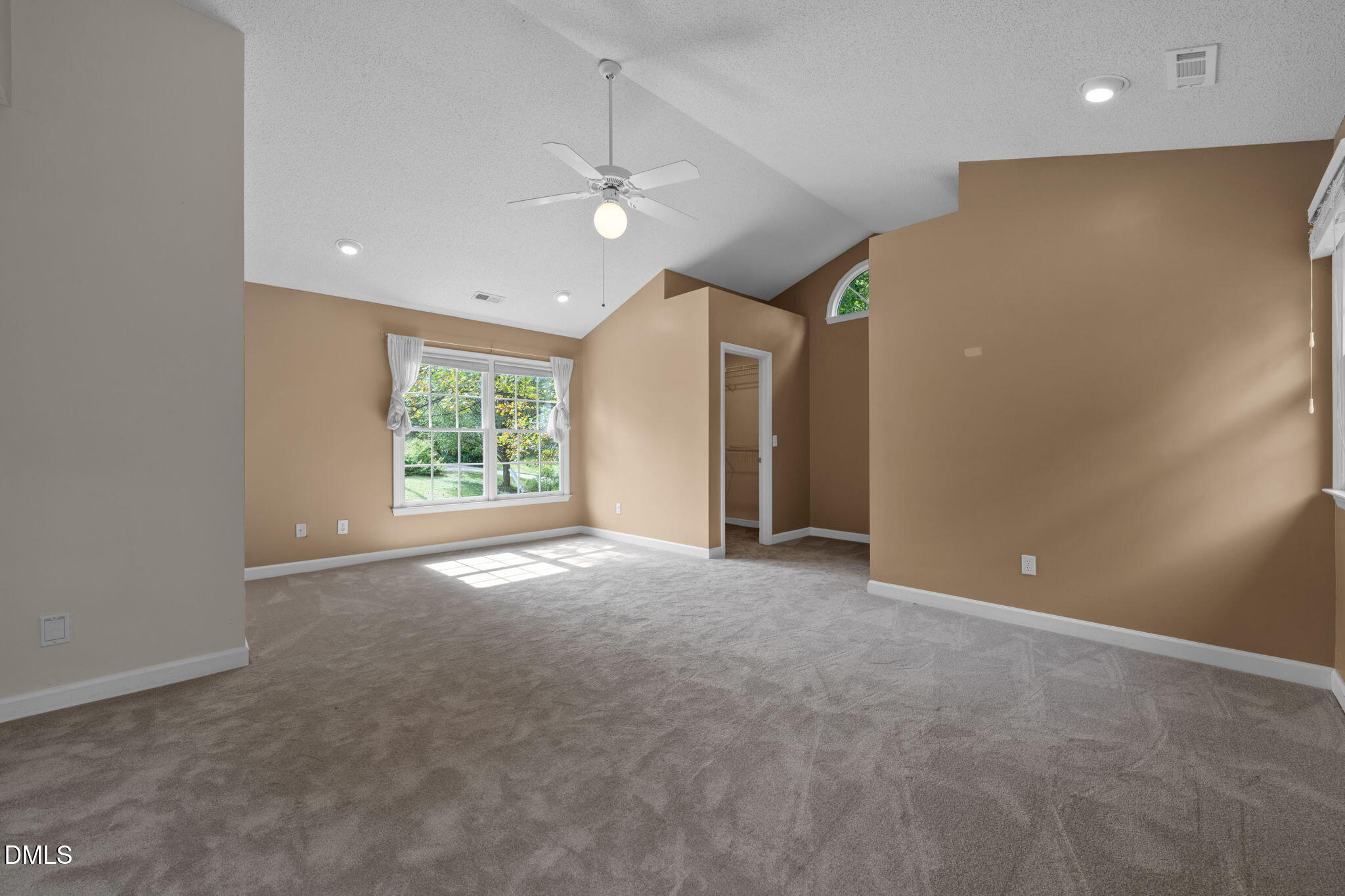 16 Quail Hunt Circle Durham, NC 27712 - Photo 23 of 61 en empty room with windows and ceiling fan