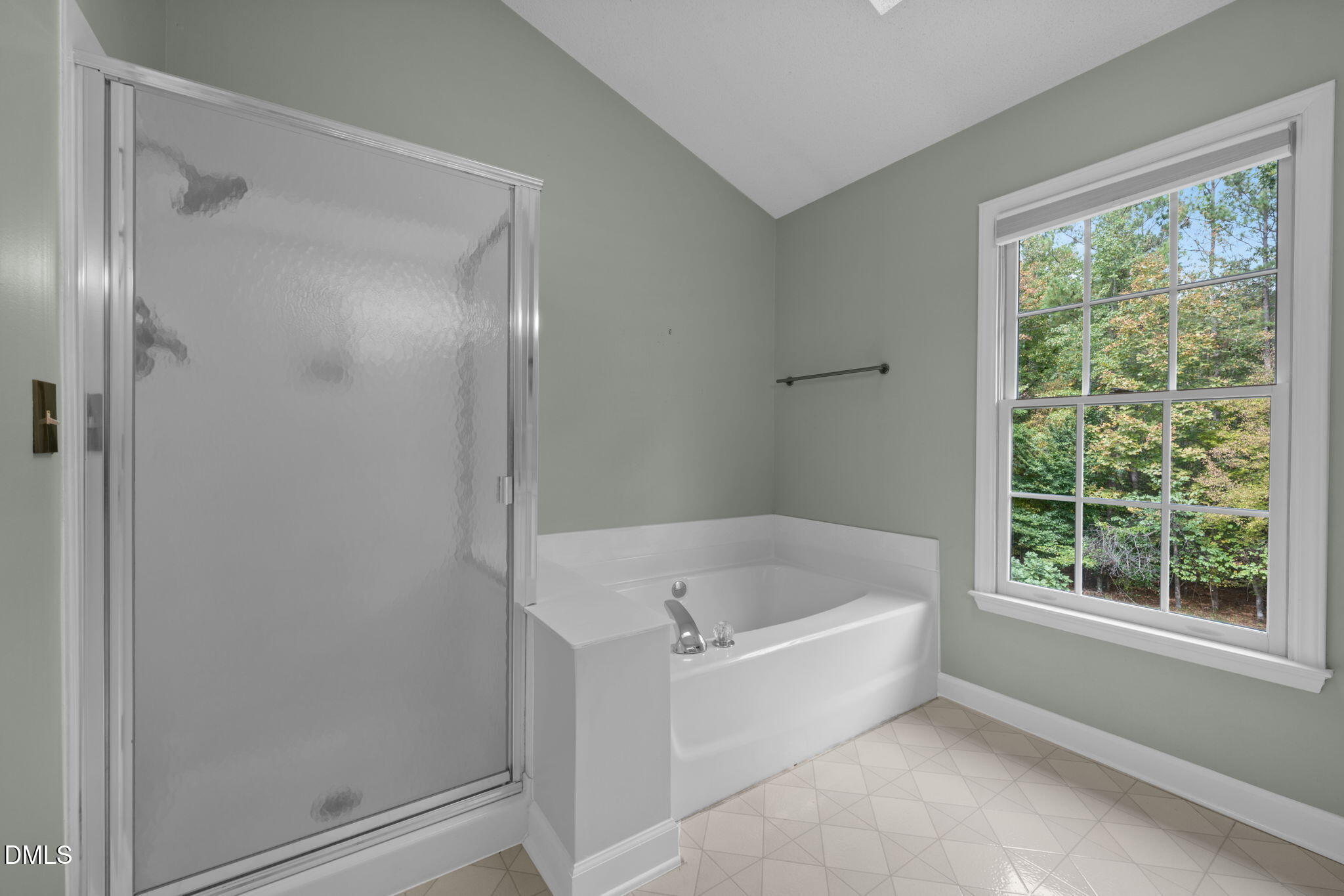 16 Quail Hunt Circle Durham, NC 27712 - Photo 27 of 61 a white bath tub sitting next to a window