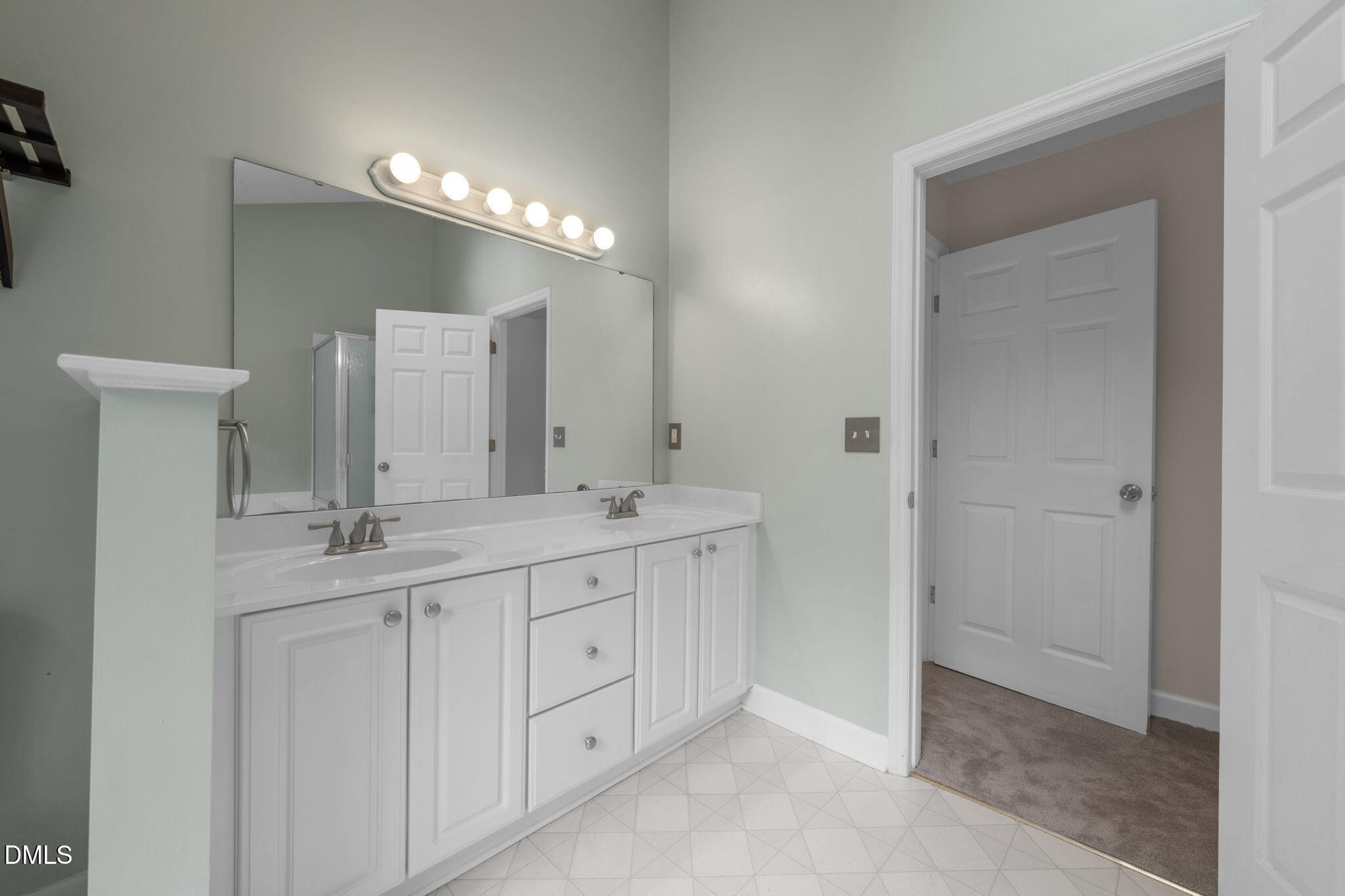 16 Quail Hunt Circle Durham, NC 27712 - Photo 28 of 61 a bathroom with double sink and a mirror