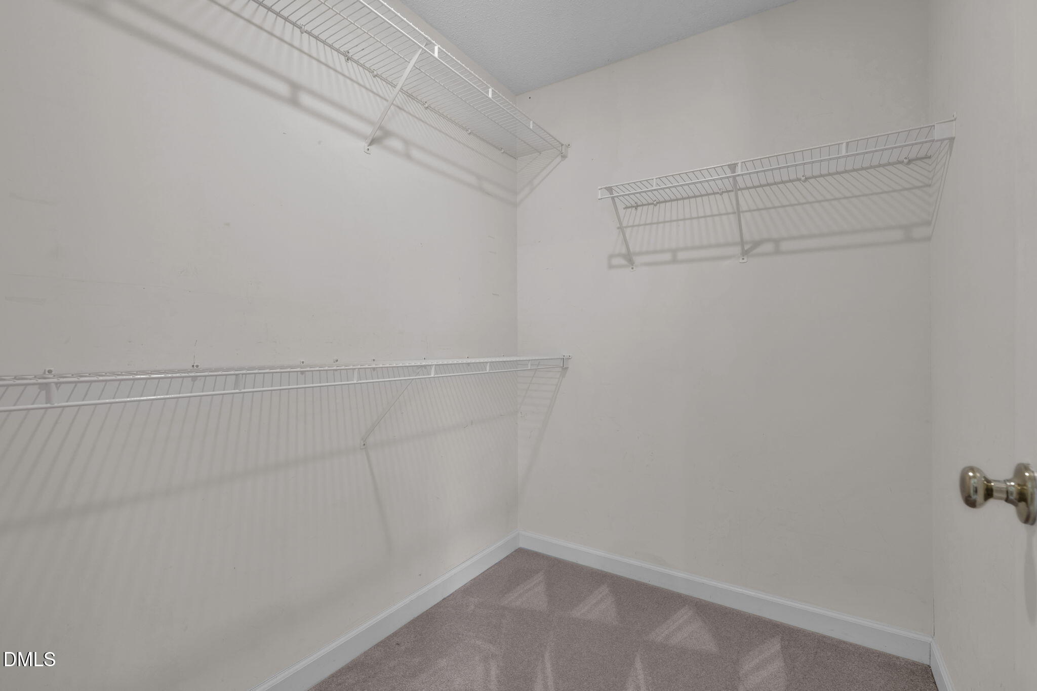 16 Quail Hunt Circle Durham, NC 27712 - Photo 29 of 61 a view of a room with racks on the wall