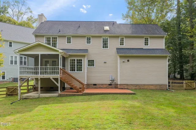 a front view of a house with parking area