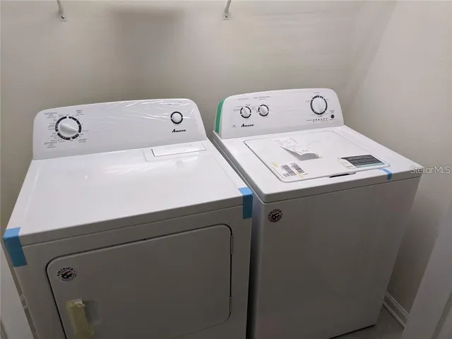 a utility room with dryer and washer