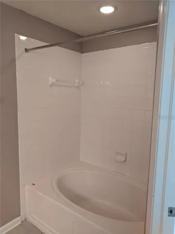 a close view of a bathtub in bathroom