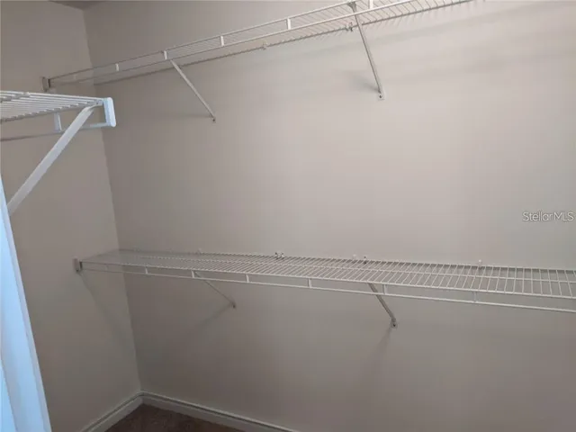 a view of a room with racks on the wall