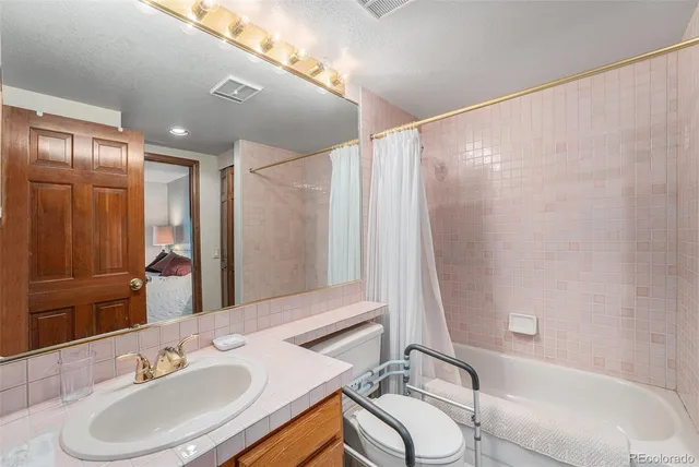 a bathroom with a sink double vanity and a mirror