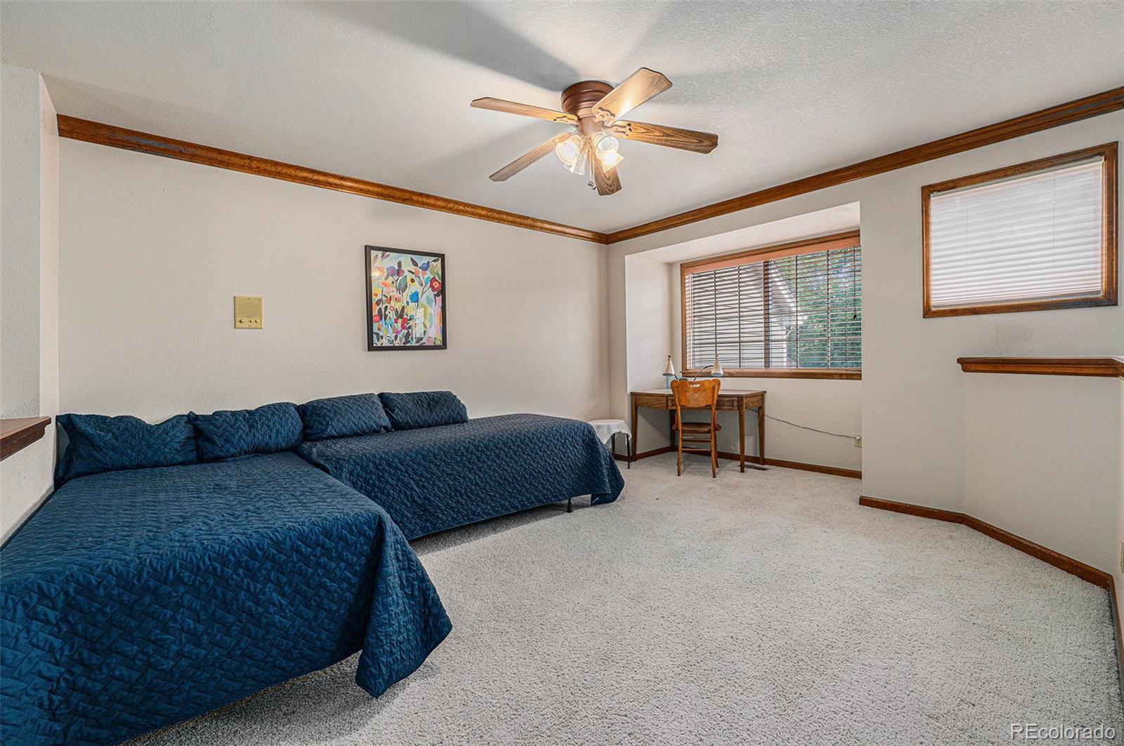 9873 Greensview Circle Lone Tree, CO 80124 - Photo 21 of 27 a living room with furniture and a window