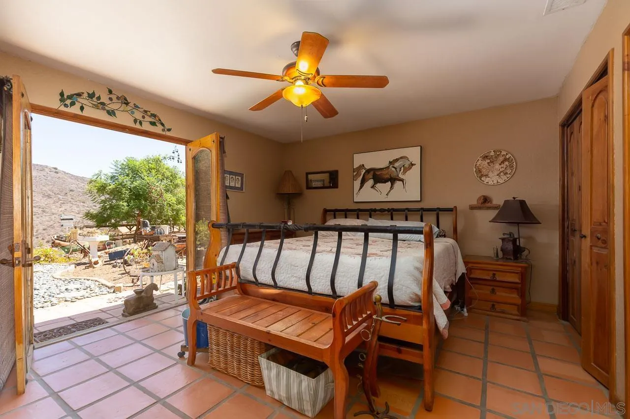 2029 Willow Glen Road Fallbrook, CA 92028 - Photo 13 of 46 a bedroom with furniture and a window