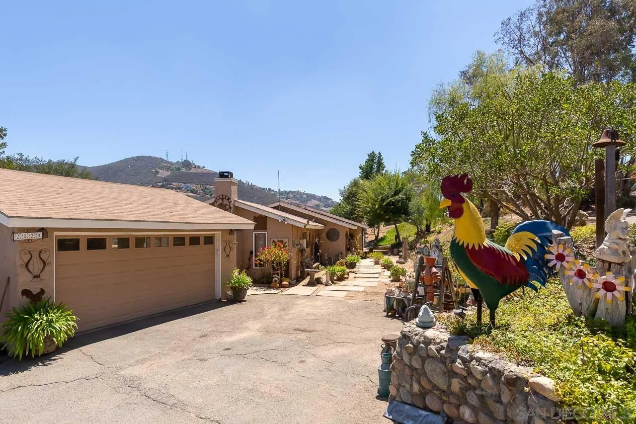 2029 Willow Glen Road Fallbrook, CA 92028 - Photo 2 of 46 a view of a house with a yard and garden