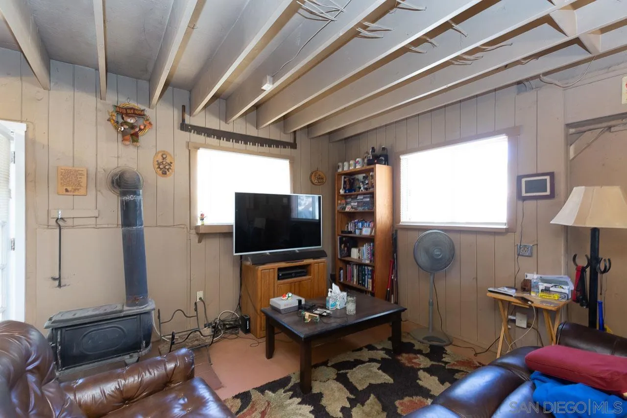 2029 Willow Glen Road Fallbrook, CA 92028 - Photo 32 of 46 a living room with furniture and a flat screen tv
