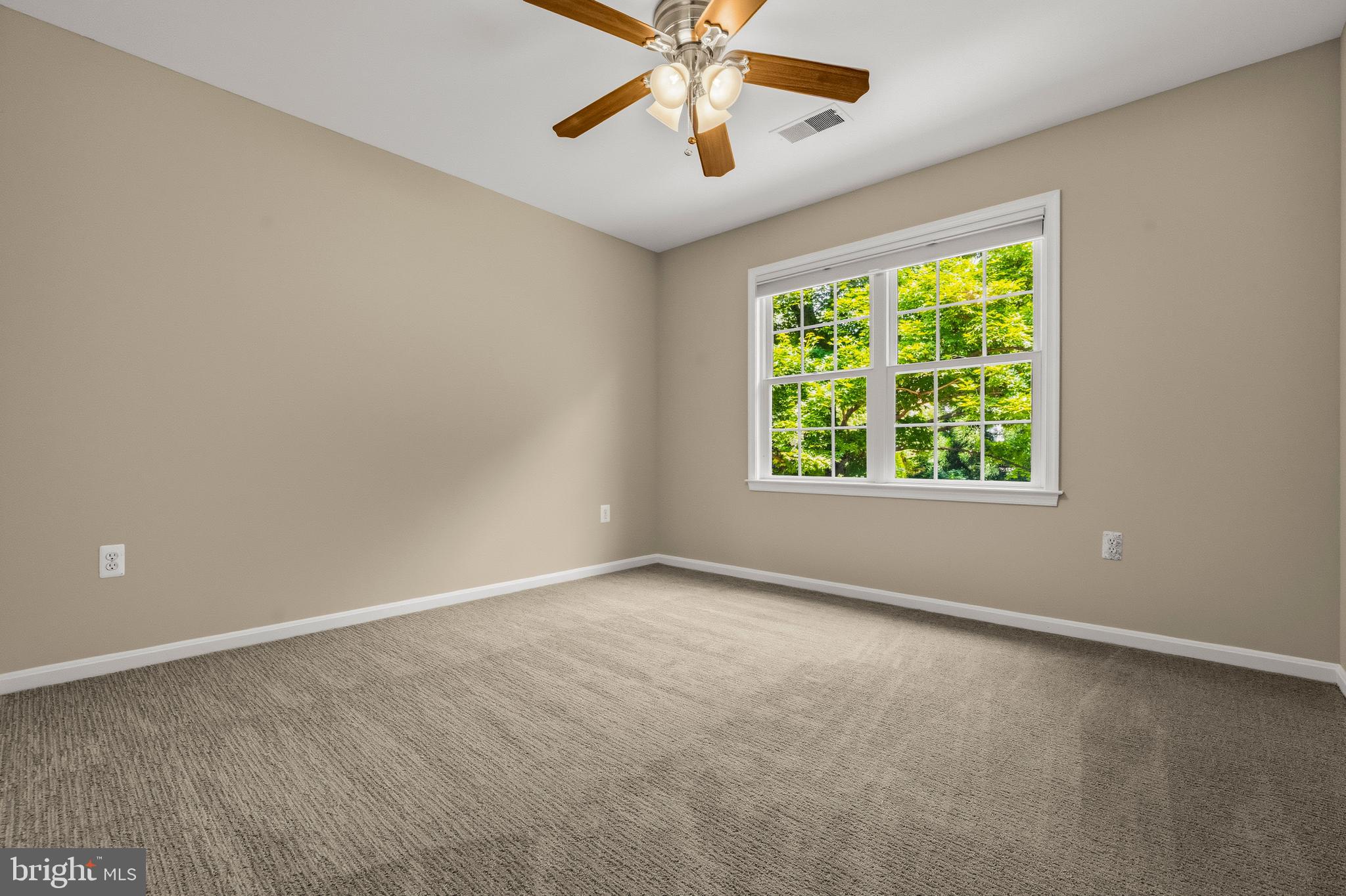 4007 West Braddock Road Alexandria, VA 22304 - Photo 48 of 52 an empty room with a window and a fan
