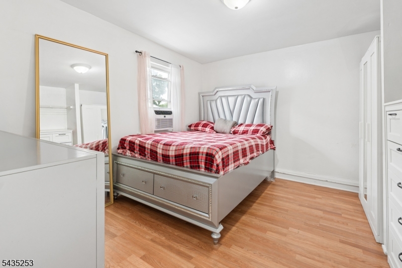 61 Union Street, Unit 2 Lodi, NJ 07644 - Photo 5 of 8 a room with a bed and a window