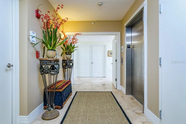 a large living room with stainless steel appliances kitchen island granite countertop a sink and a granite counter tops