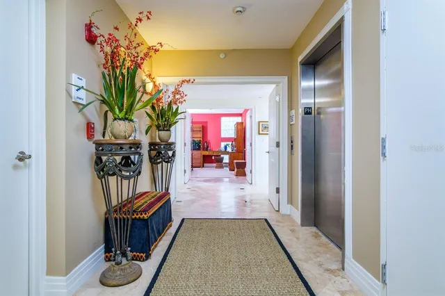 a bathroom with a tub and a painting on the wall