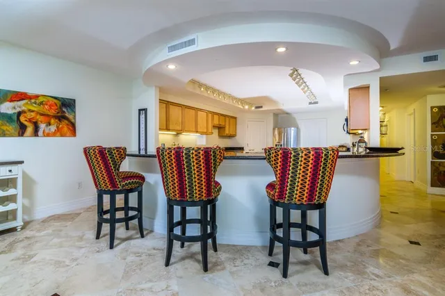 a view of a swimming pool with outdoor seating