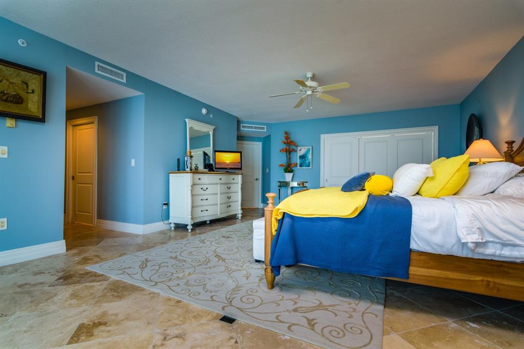 1350 Gulf Boulevard, Unit 901 Clearwater Beach, FL 33767 - Photo 36 of 63 a living room with a bed and furniture