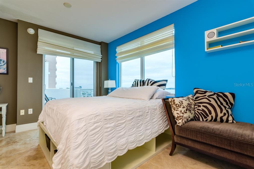1350 Gulf Boulevard, Unit 901 Clearwater Beach, FL 33767 - Photo 41 of 63 a bedroom with bed couch and window