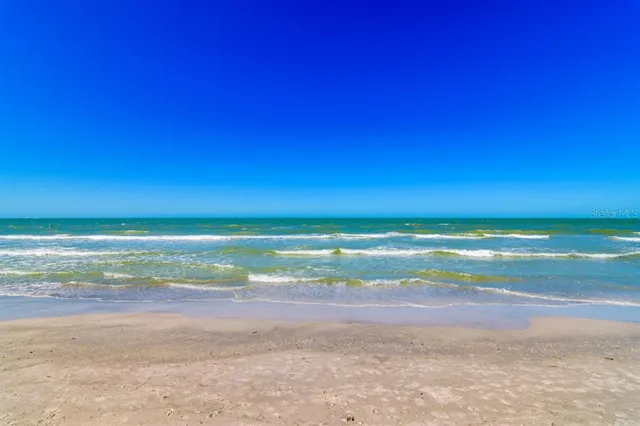 a kitchen with stainless steel appliances granite countertop a sink dishwasher and cabinets with wooden floor