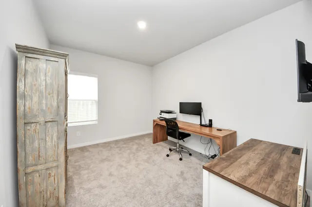 a workspace with furniture and window