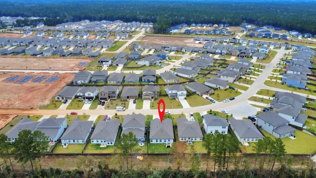 an aerial view of residential building and lake