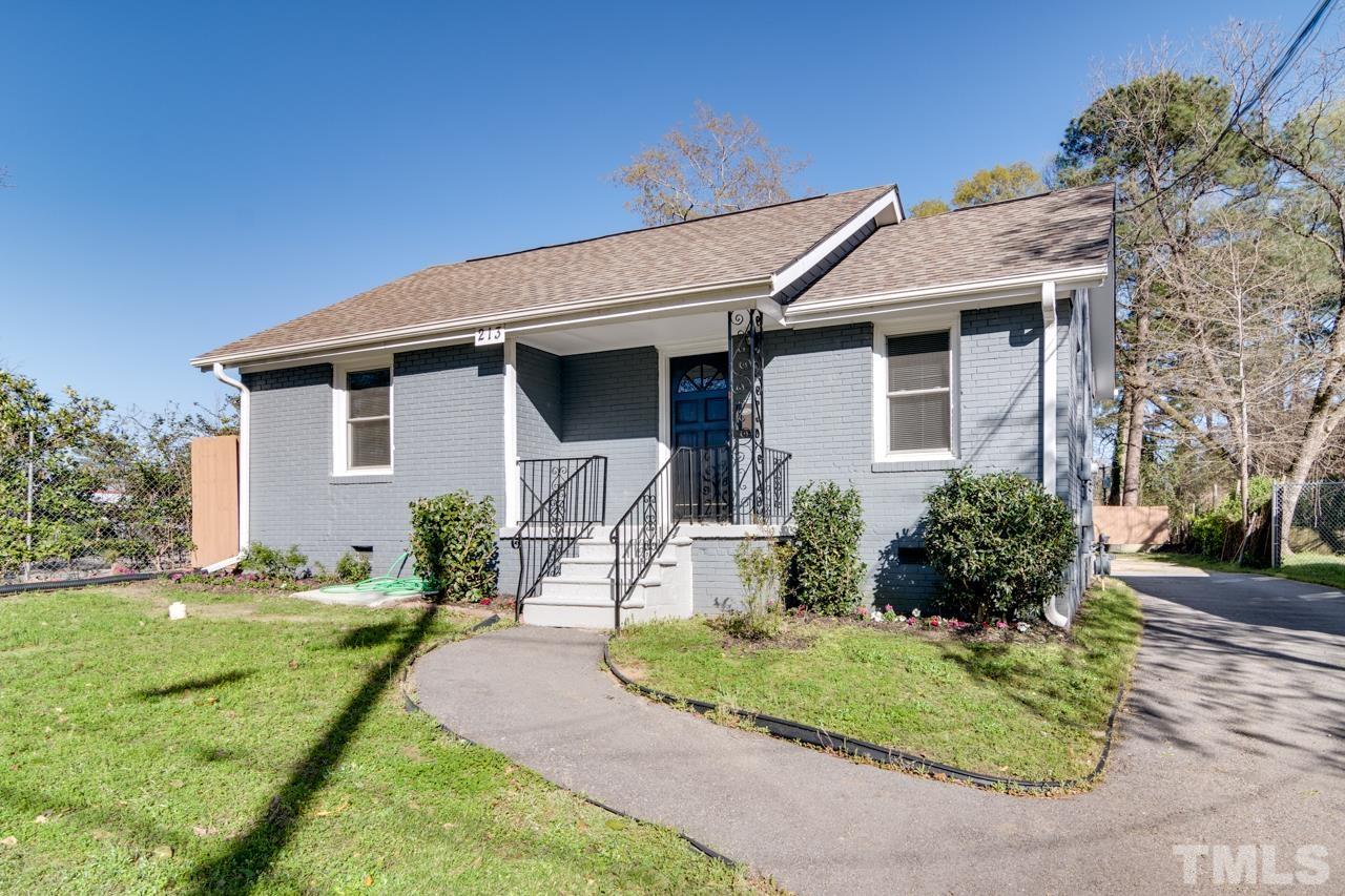 213 Angier Avenue Raleigh, NC 27610 - Photo 2 of 38 a front view of a house with a yard