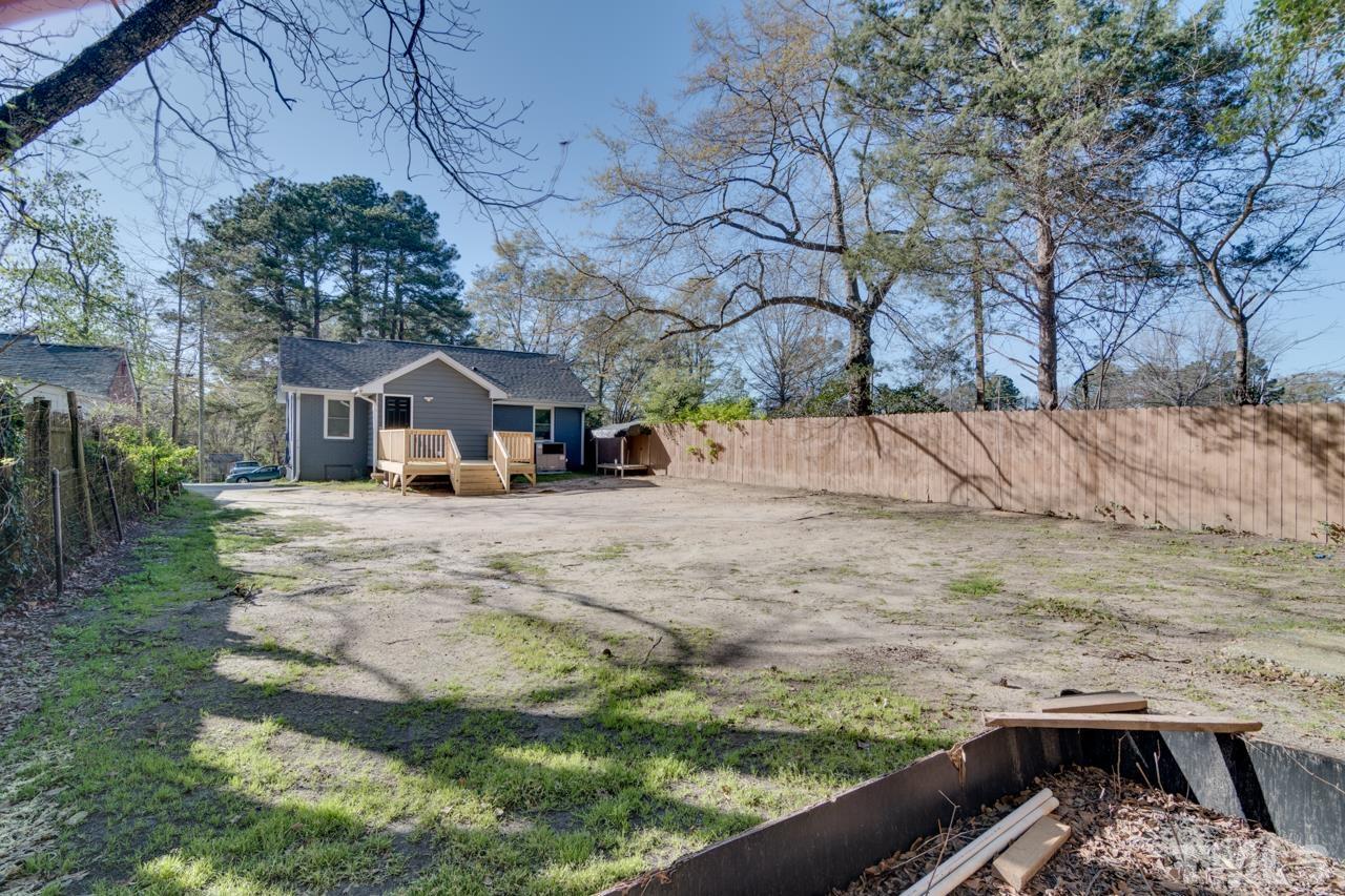 213 Angier Avenue Raleigh, NC 27610 - Photo 35 of 38 a view of a house with a yard
