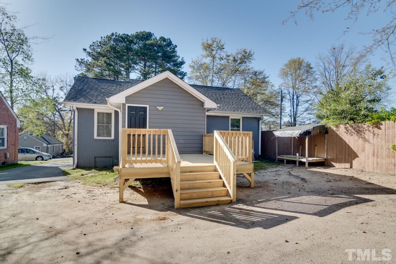 213 Angier Avenue Raleigh, NC 27610 - Photo 37 of 38 a view of a house with a yard and wooden fence
