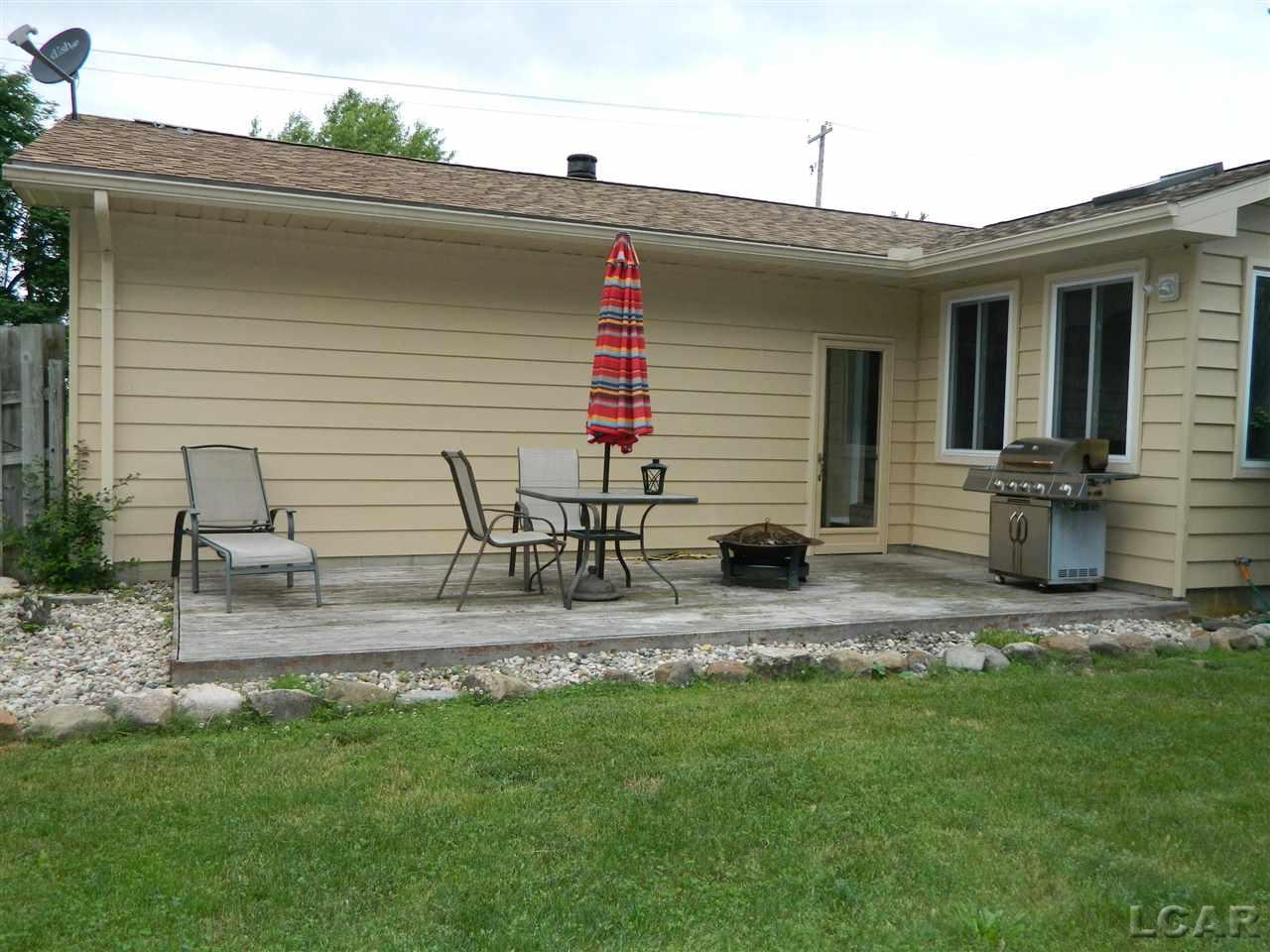 2689 West Russell Road Tecumseh, MI 49286 - Photo 27 of 28 Back deck for enjoying cookouts, laying in the sun, reading a book while bird watching, etc.