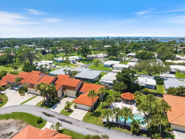 an aerial view of residential houses with outdoor space