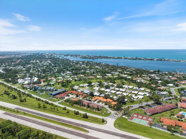 an aerial view of residential houses with outdoor space