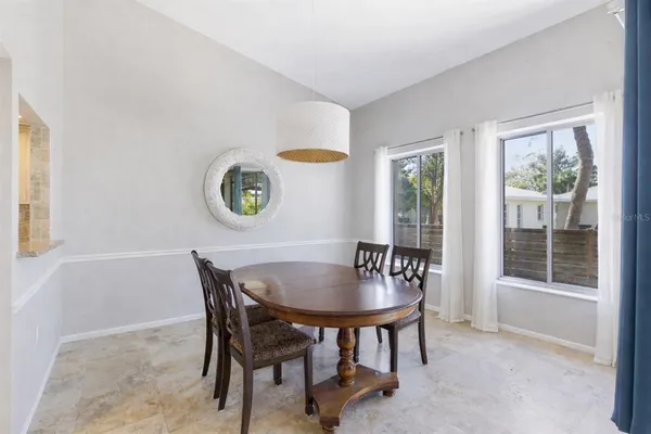 a view of a dining room with furniture and window