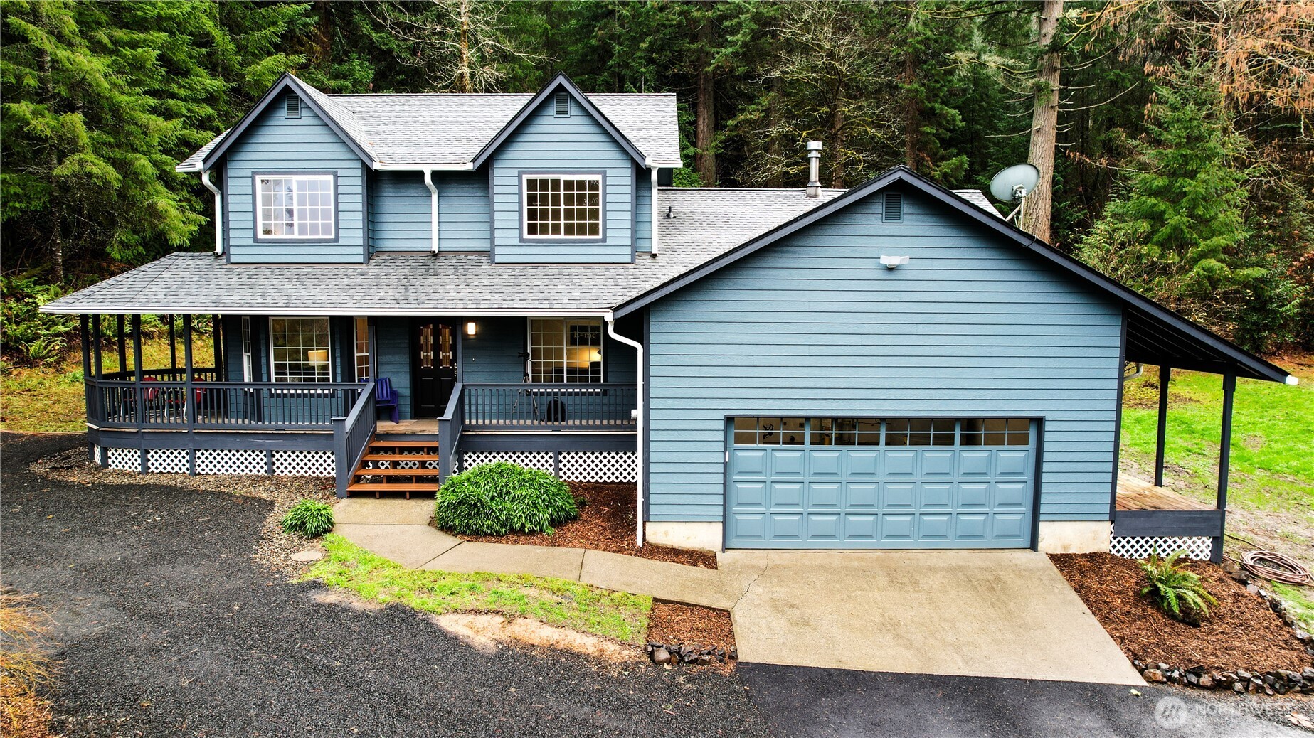 a view of house with outdoor space area and wooden fence