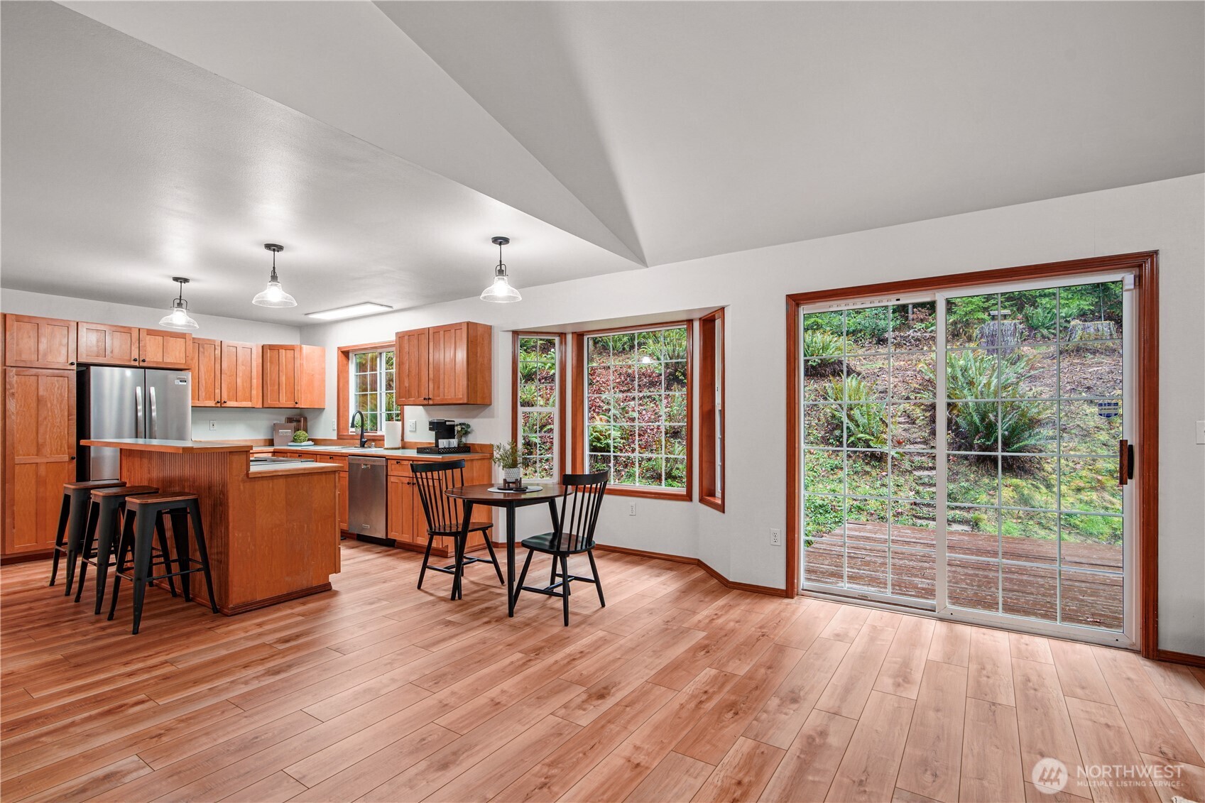8045 Prather Road Southwest Centralia, WA 98531 - Photo 13 of 33 a dining hall with stainless steel appliances wooden floors and large windows