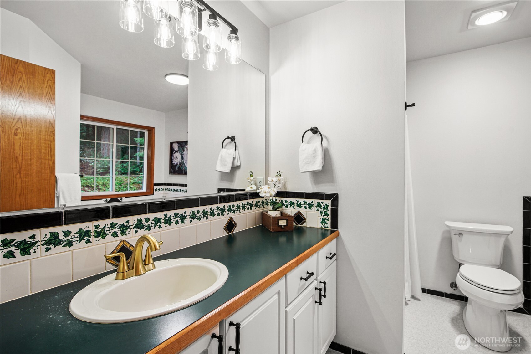 8045 Prather Road Southwest Centralia, WA 98531 - Photo 19 of 33 a bathroom with a sink double vanity and a mirror
