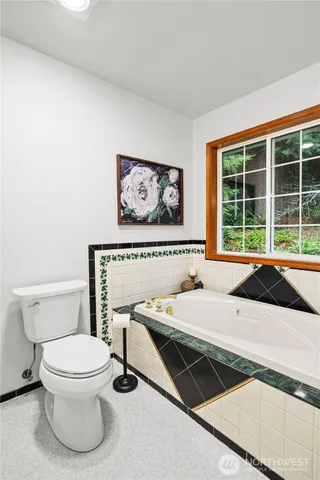 a spacious bedroom with a bed and a large window