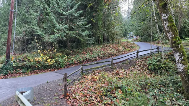 a view of a garden with wooden fence