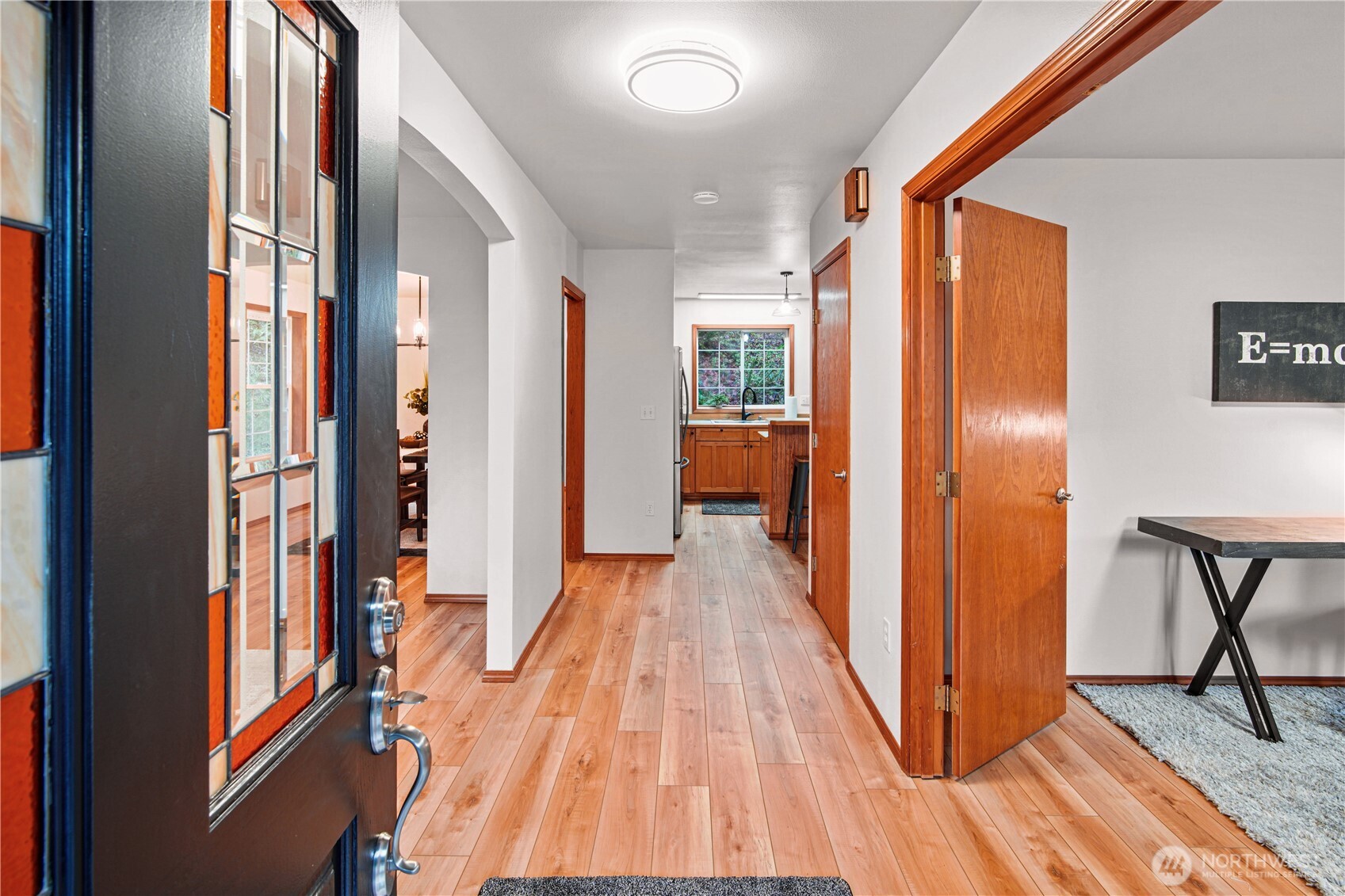 8045 Prather Road Southwest Centralia, WA 98531 - Photo 7 of 33 a view of a hallway with wooden floor and furniture