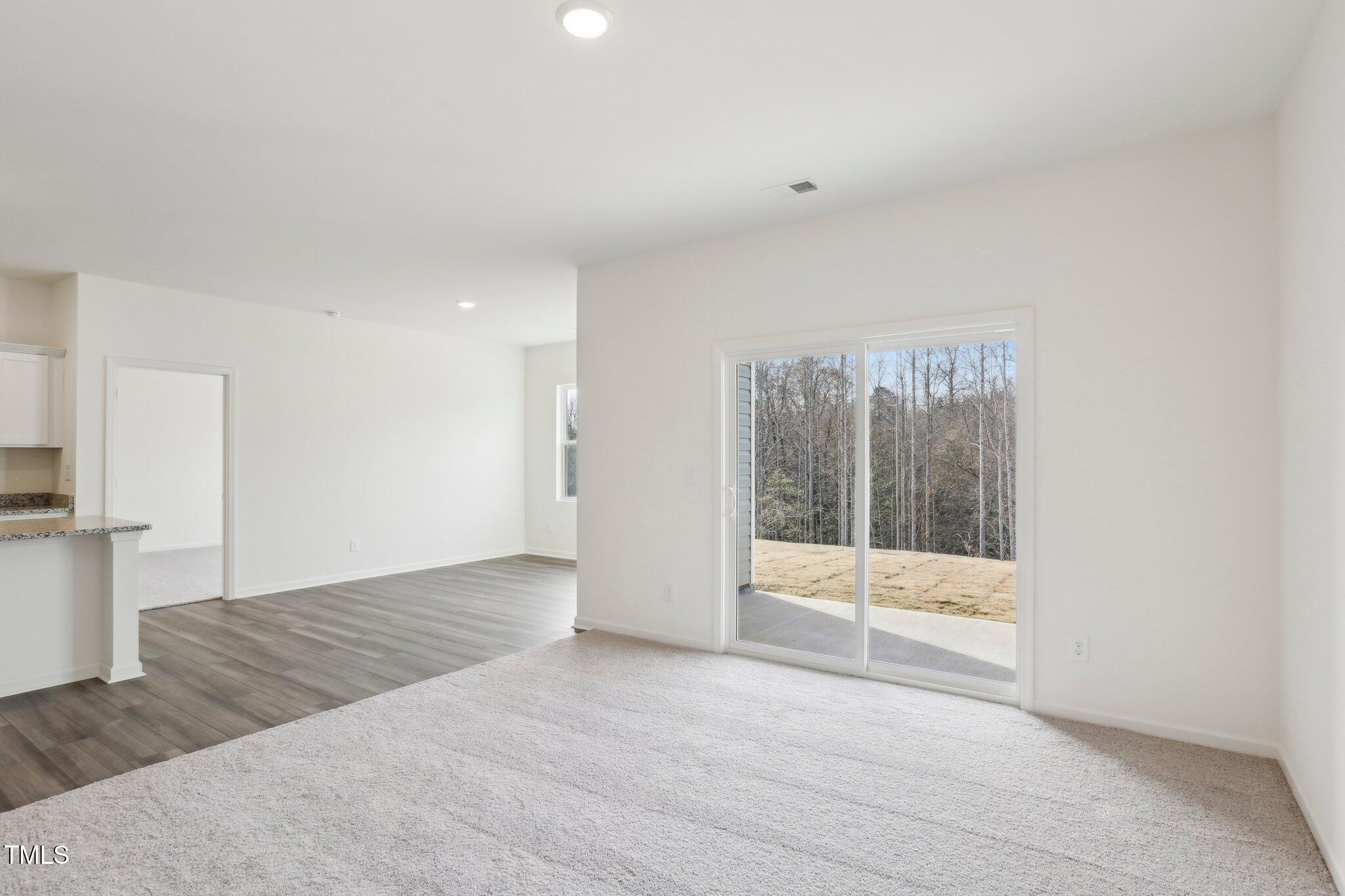 899 Embraer Way Spring Spring Hope, NC 27882 - Photo 13 of 43 a view of an empty room with a window