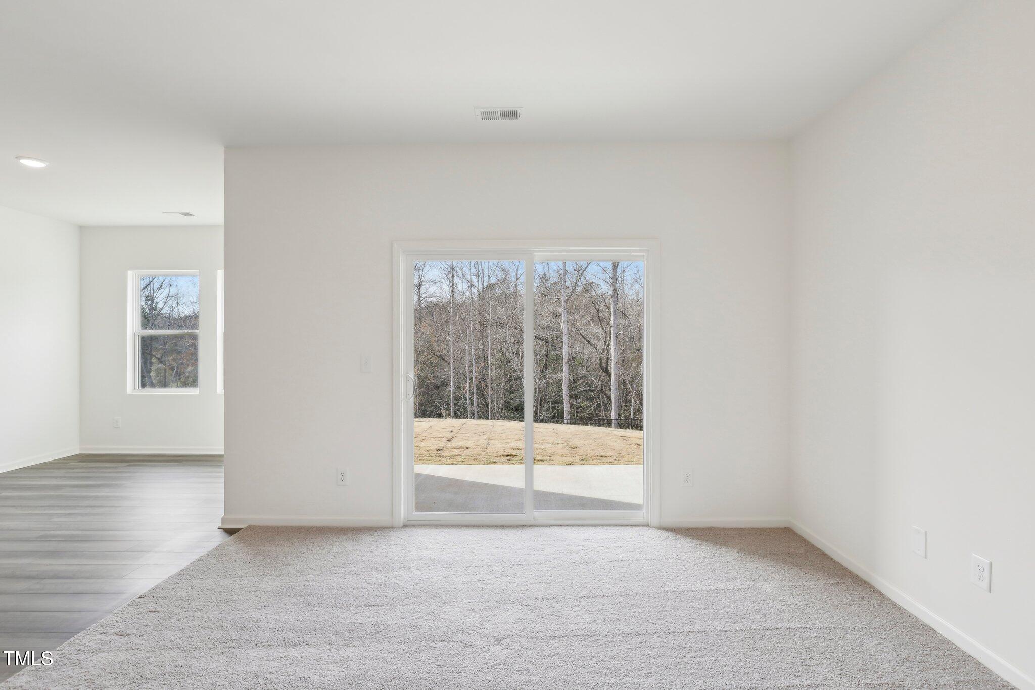 899 Embraer Way Spring Spring Hope, NC 27882 - Photo 18 of 43 an empty room with windows
