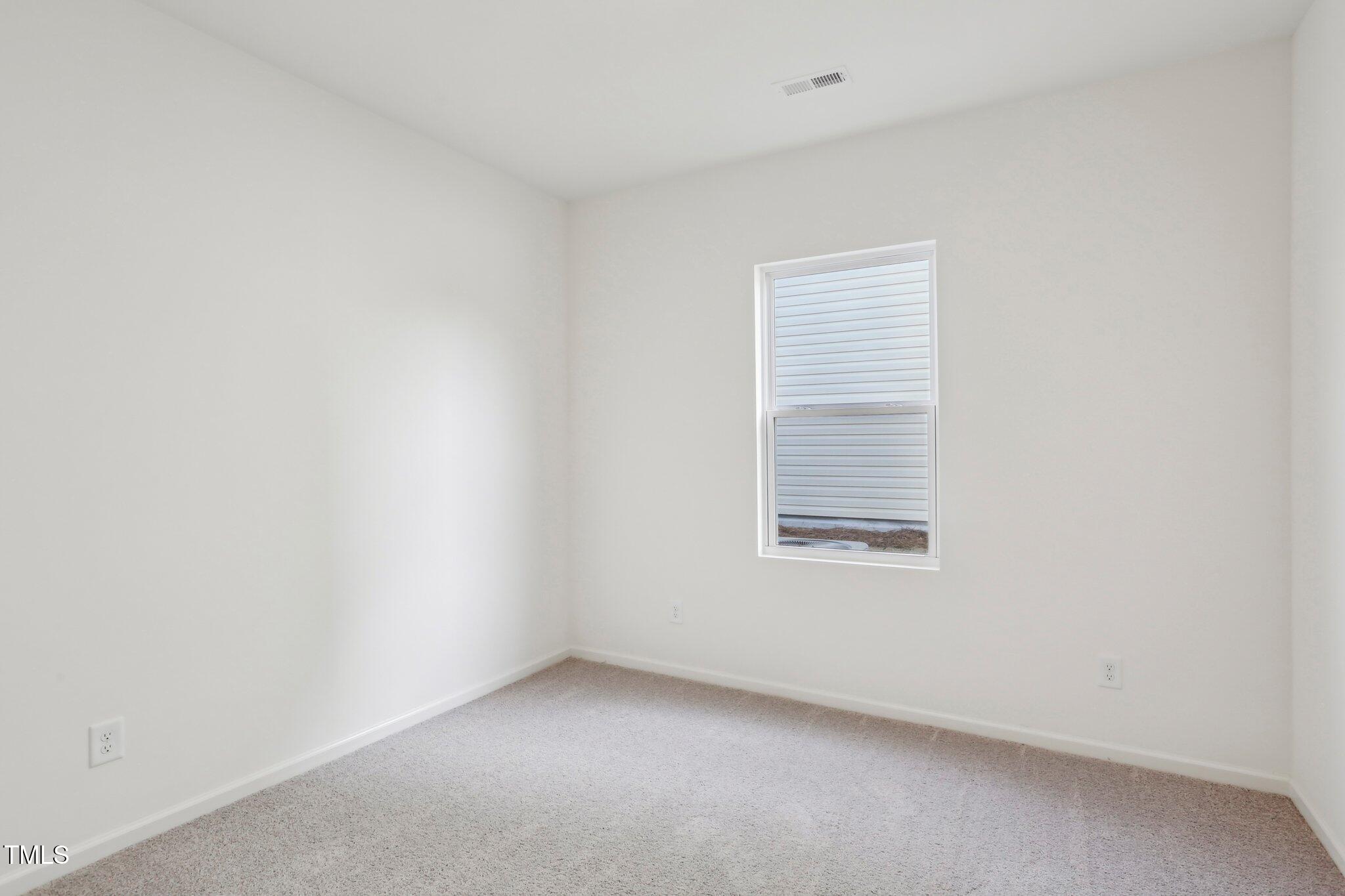 899 Embraer Way Spring Spring Hope, NC 27882 - Photo 21 of 43 an empty room with a window