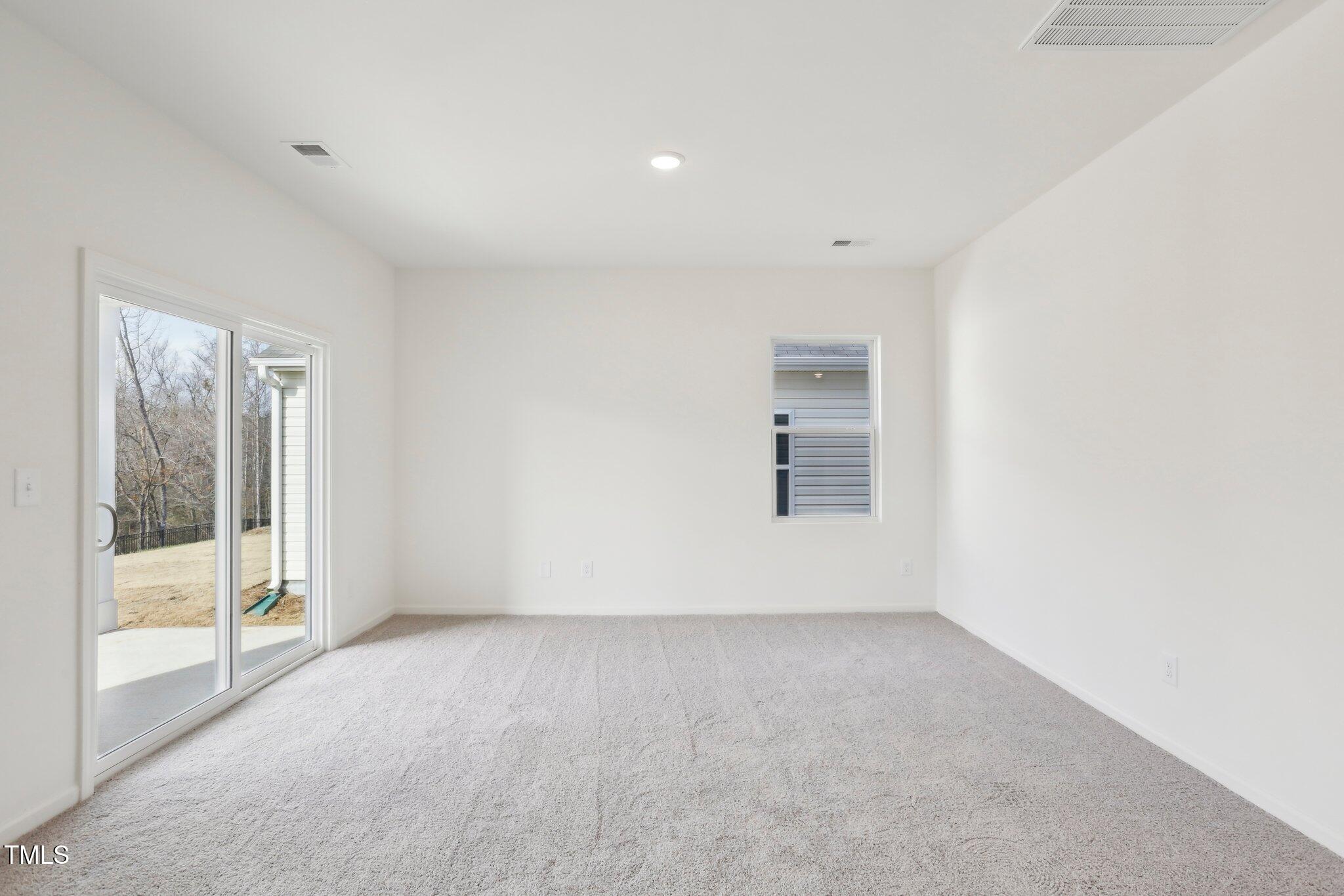 899 Embraer Way Spring Spring Hope, NC 27882 - Photo 23 of 43 a view of an empty room with a window