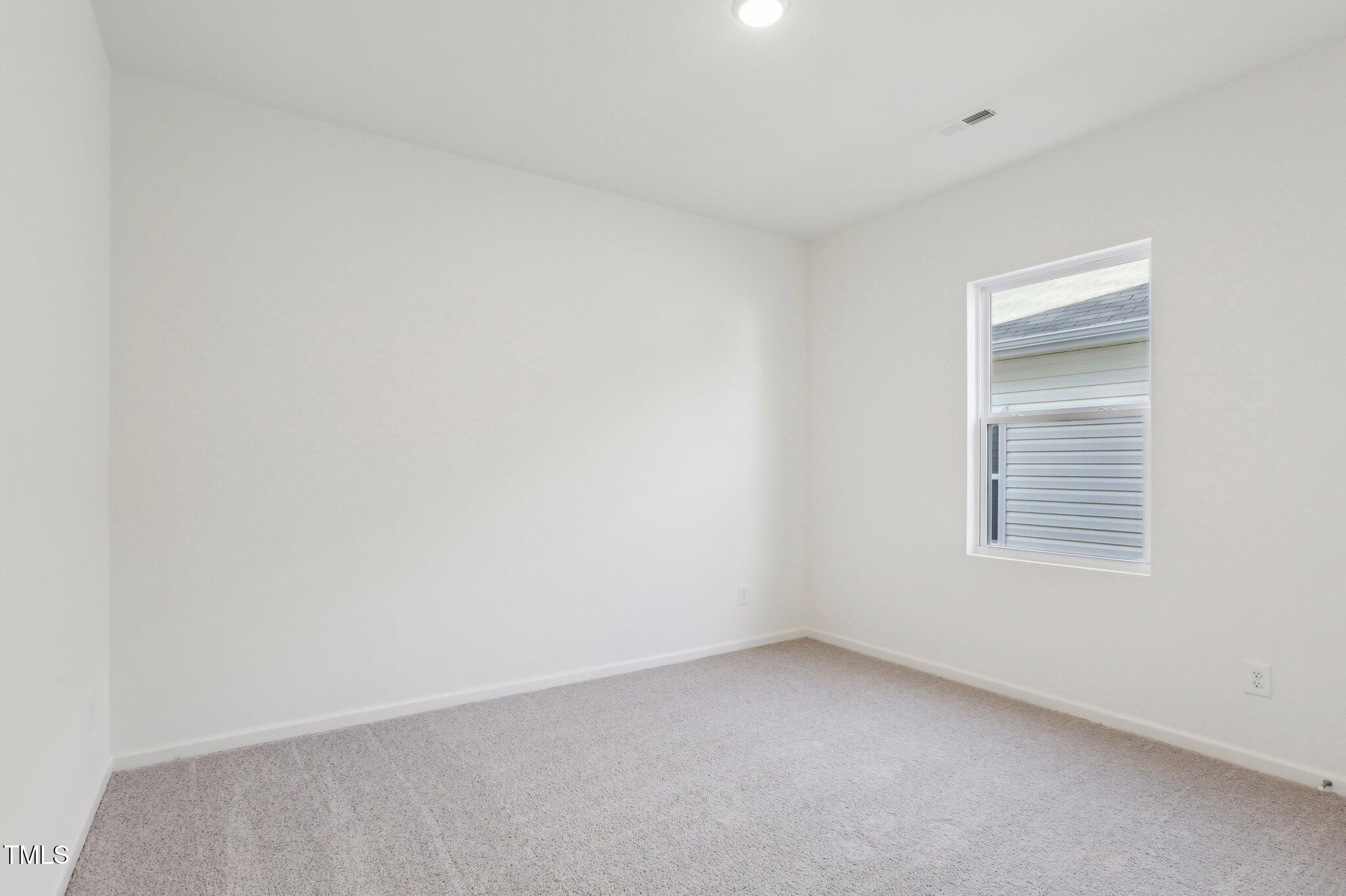 899 Embraer Way Spring Spring Hope, NC 27882 - Photo 26 of 43 a view of an empty room with a window