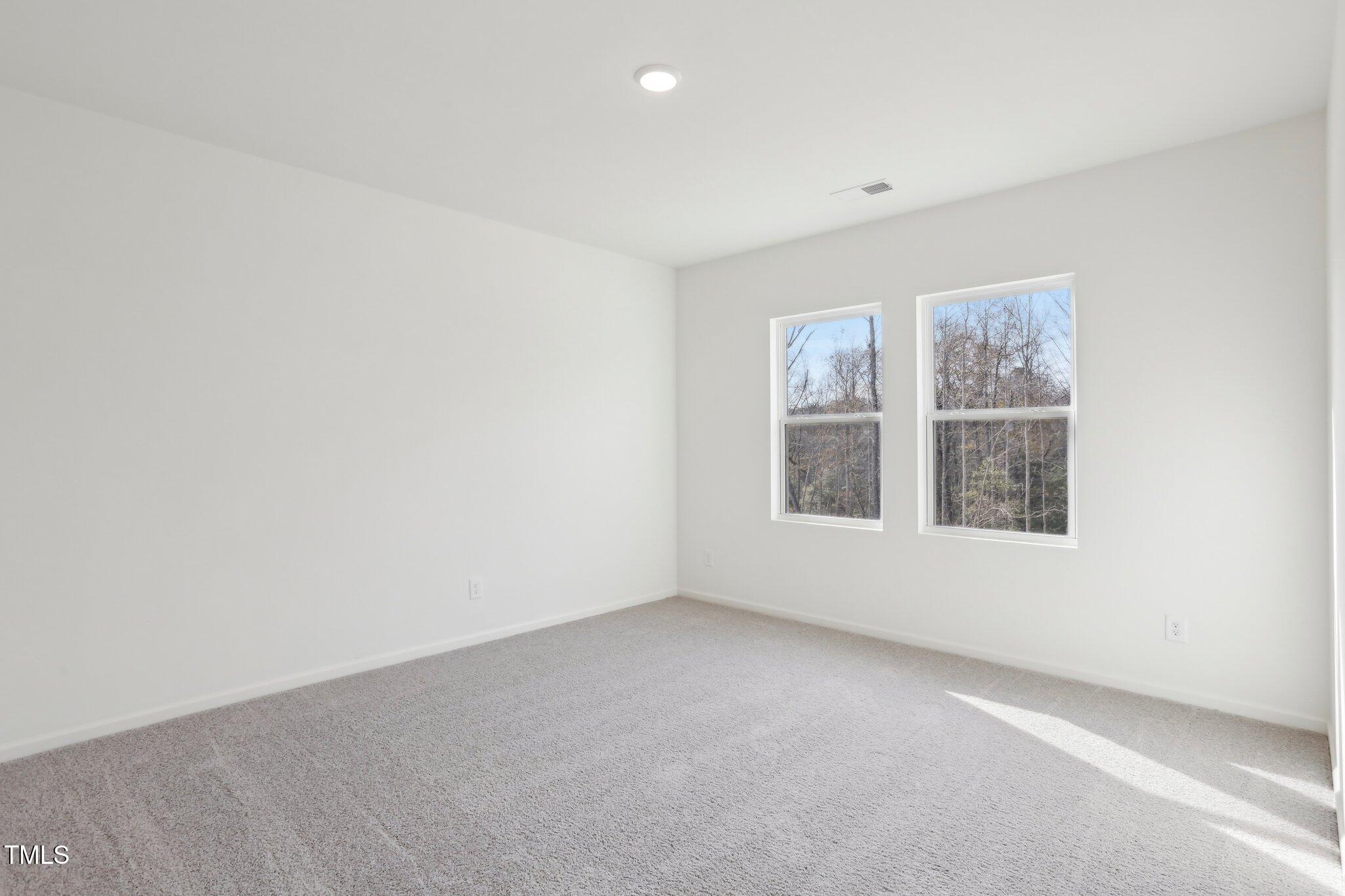 899 Embraer Way Spring Spring Hope, NC 27882 - Photo 27 of 43 an empty room with windows